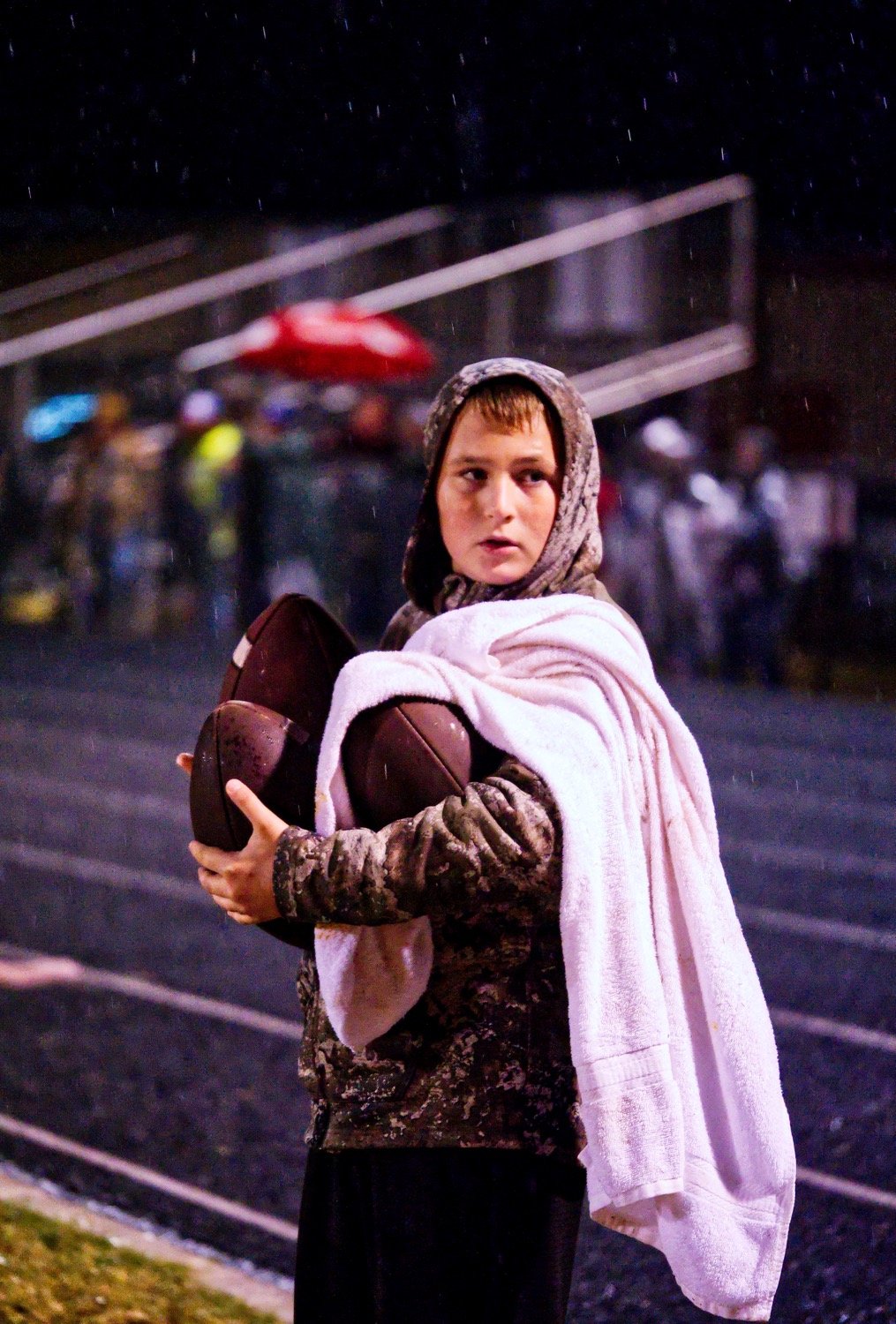 The role of ball boy was essential as ever Friday night, with the important responsibility of keeping a dry ball ready for the next Panther offensive play. [find more football photos]